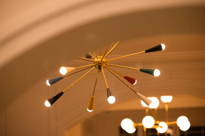 A starburst chandelier with colorful accents.